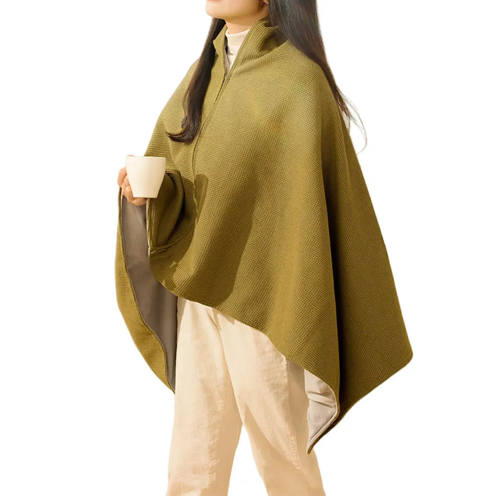 Person wearing a green poncho holding a cup on a white background